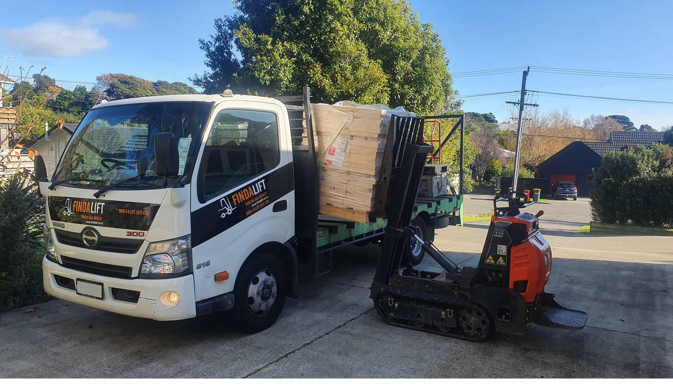 forklift loading firewood for delivery